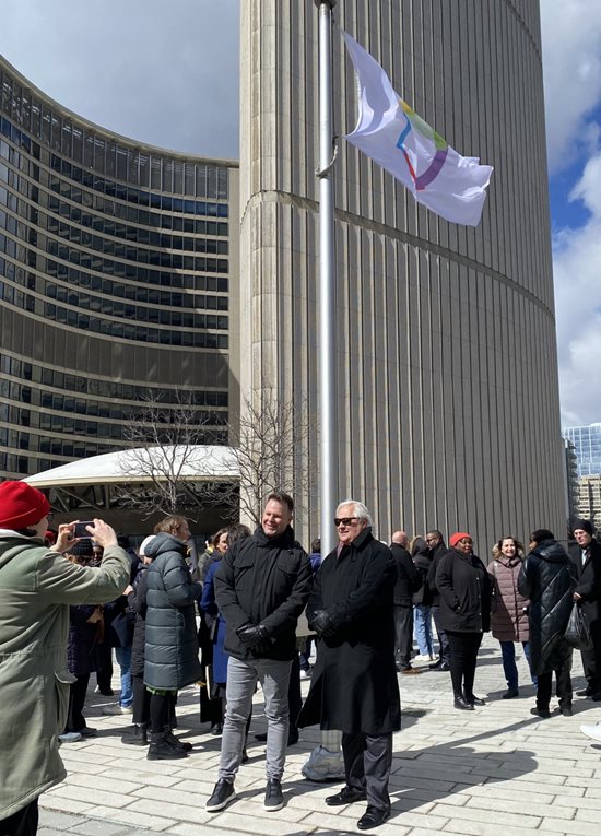 March 20, 2024: Ombudsman Paul Dubé and French Language Services Commissioner Carl Bouchard at the raising of the International Francophonie Day flag at Toronto City Hall.